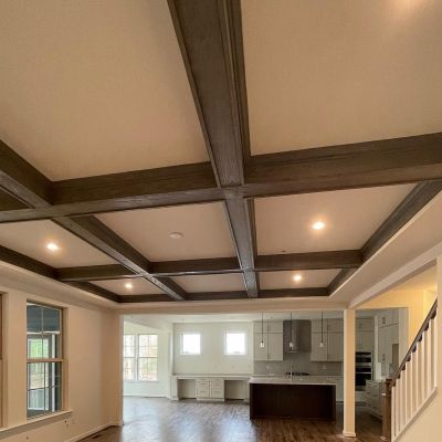 A Long View Of A Hall In A House With All Household Essentials And Lush Brown Marble Flooring With Strokes Of Sunlight
