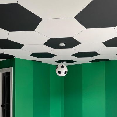 Customized Room With Green Shaded Walls Black And White Football Patterns On Ceilings And A Football Lamp Hanging