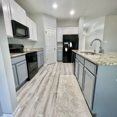 Kitchen With Refinished Gray Lower And White Upper Cabinets