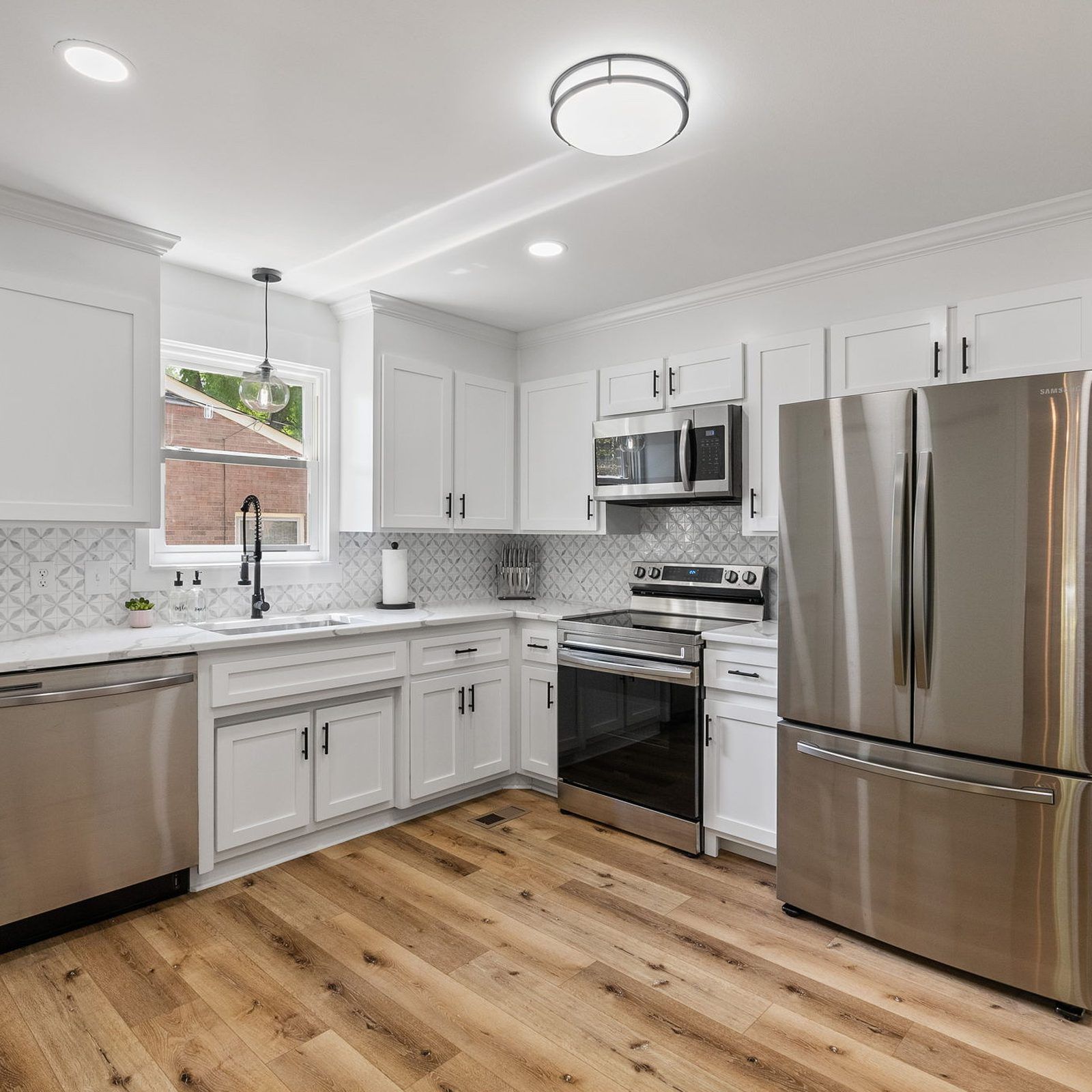 White Refinished Kitchen Cabinets With Stainless Appliances