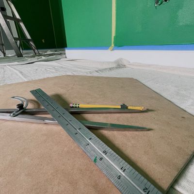 Math Compass Rule And Other Painting Essentials In A Room Being Painted