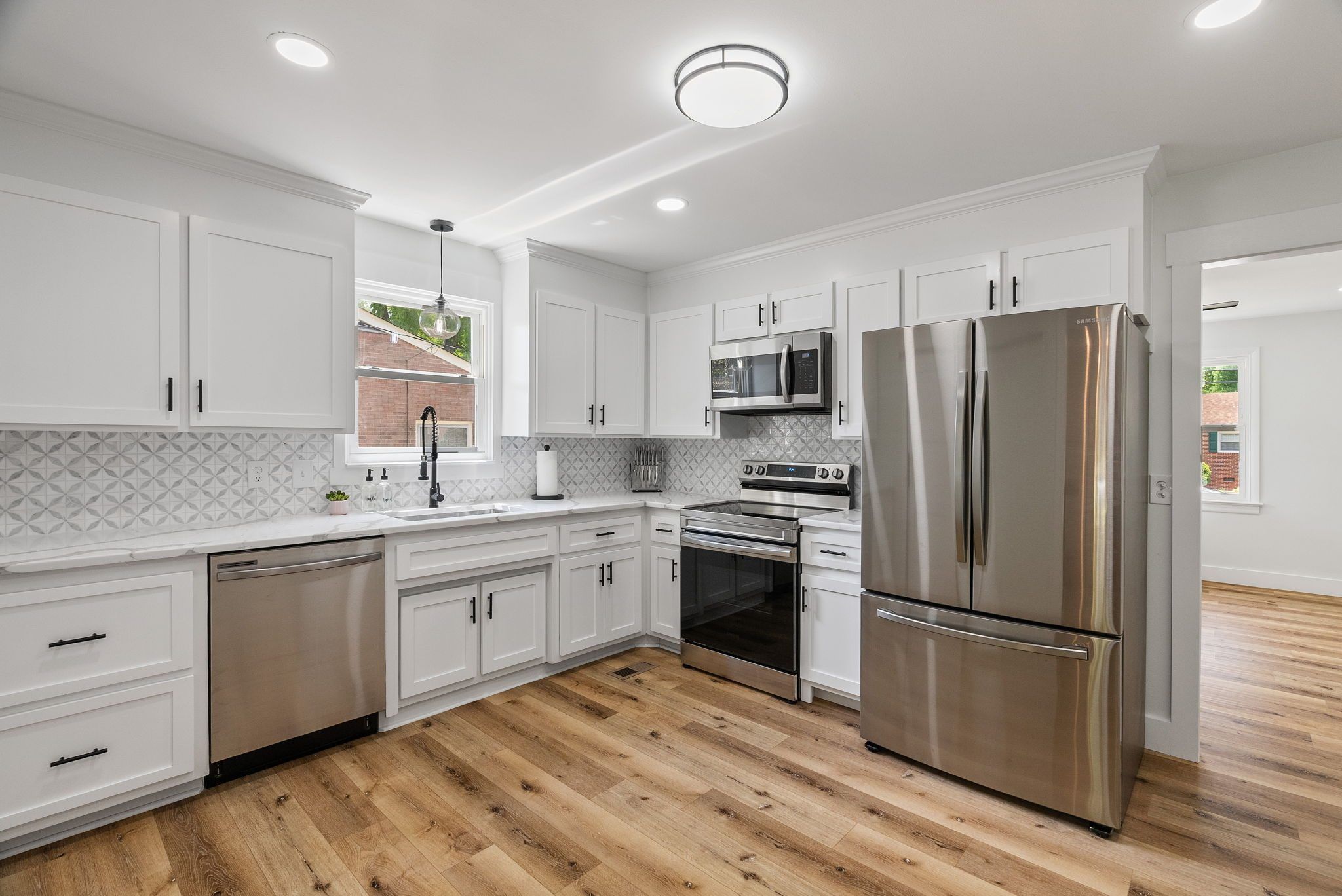 White Refinished Kitchen Cabinets With Stainless Appliances