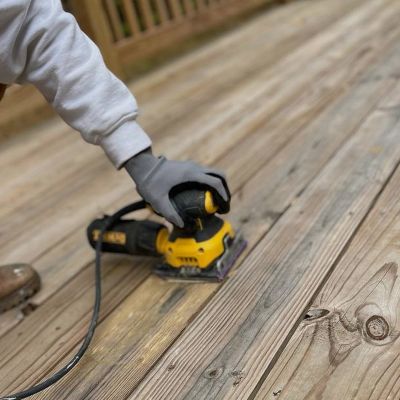 Lets Upgrade Painting Employee Sanding Deck Boards