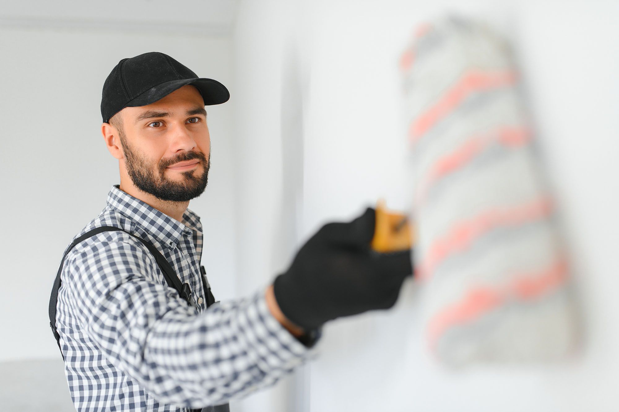 Residential Painter Rolling After Cutting In Wall Painted Section