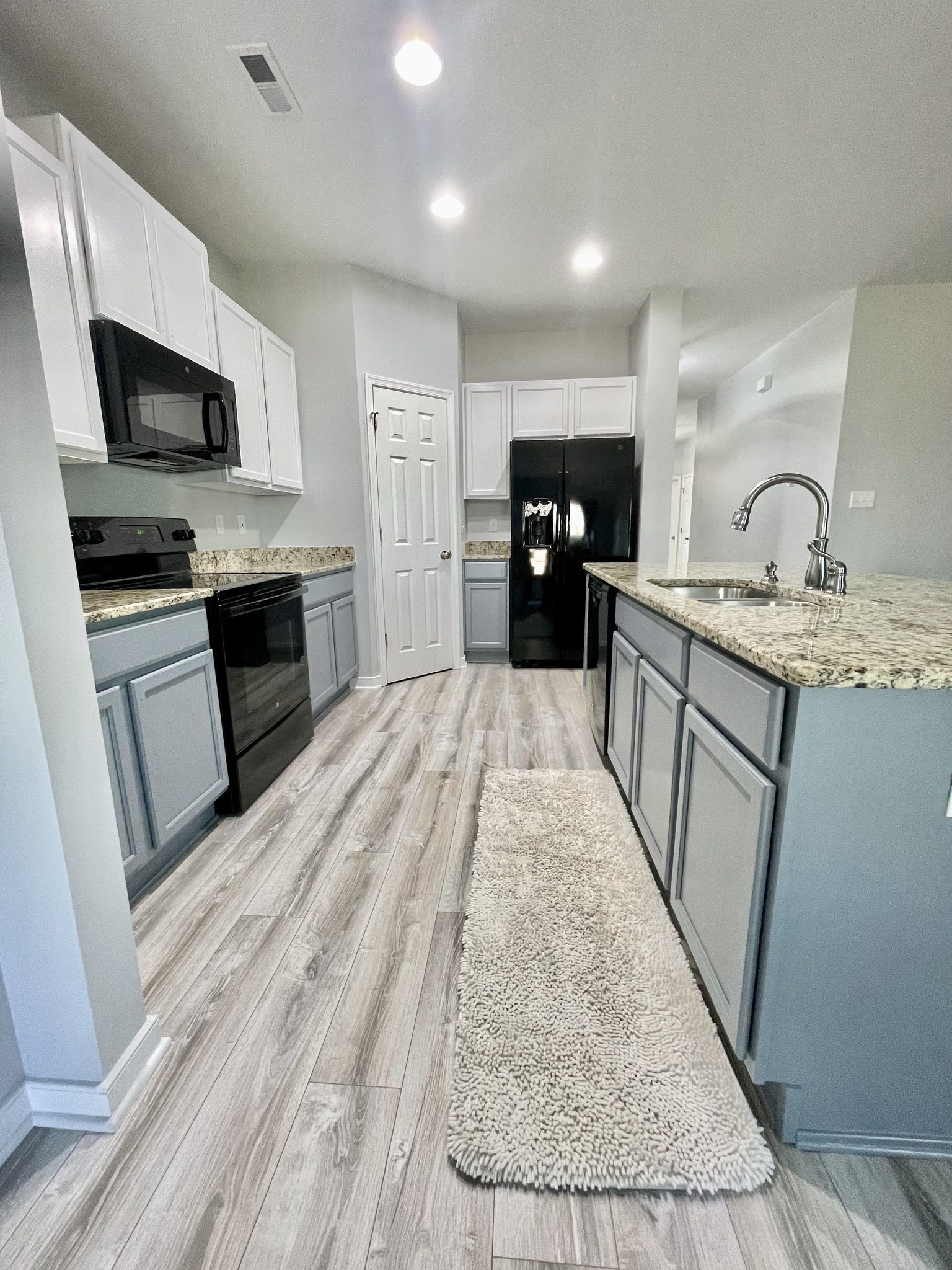 Kitchen With Refinished Gray Lower And White Upper Cabinets