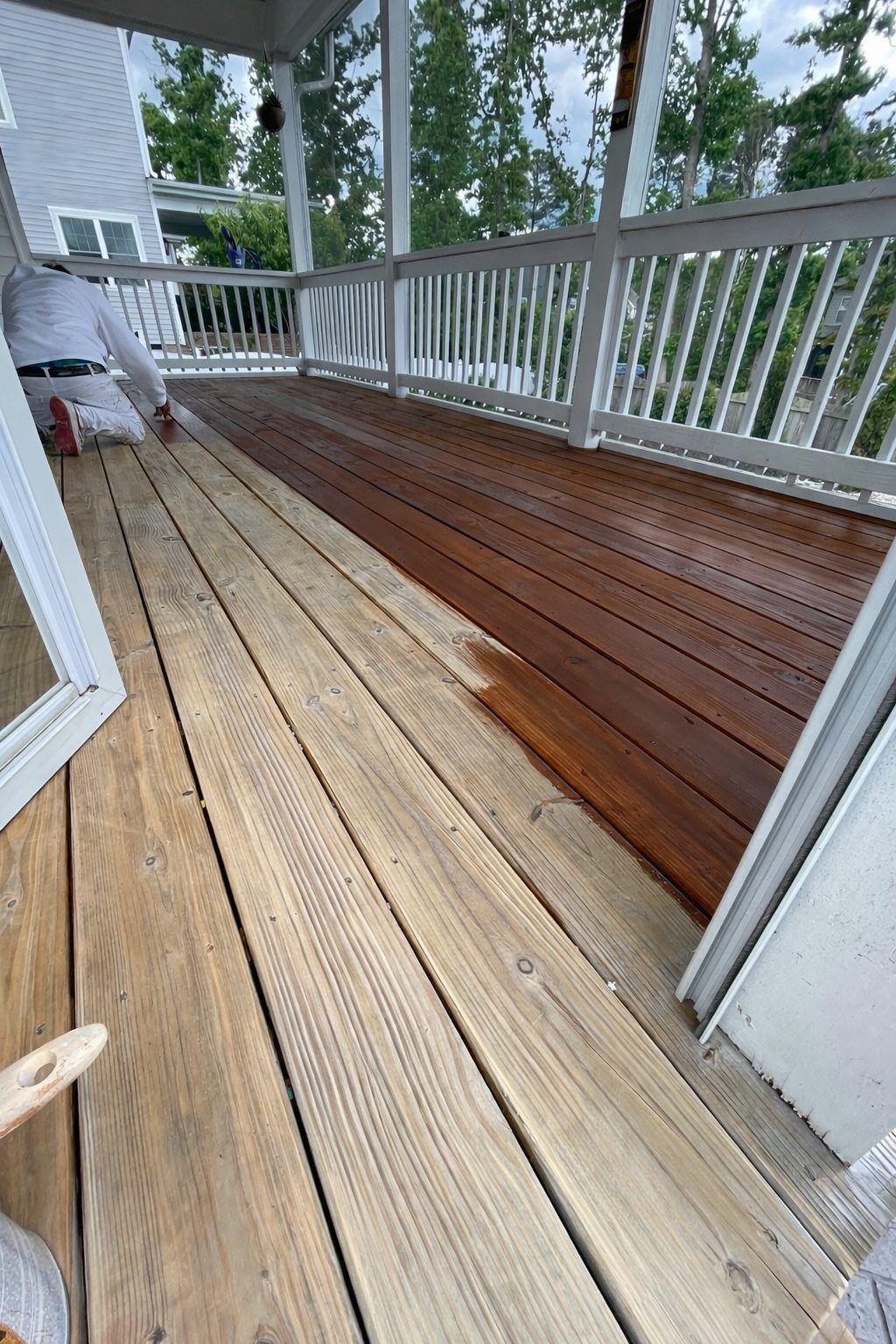 Raised Deck Boards Half Stained During Deck Staining