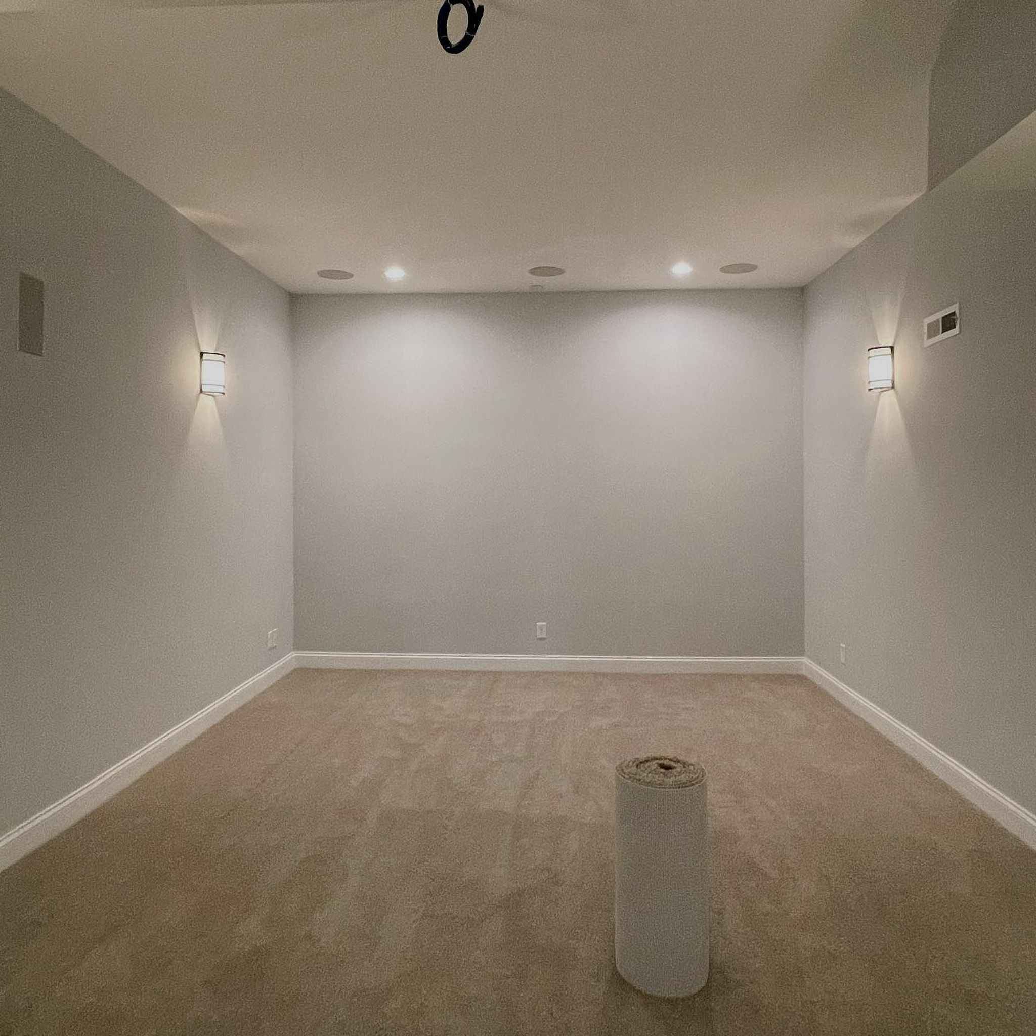 Three-Wall-View Of A Room With Forest Green Painted Walls And White Ceiling