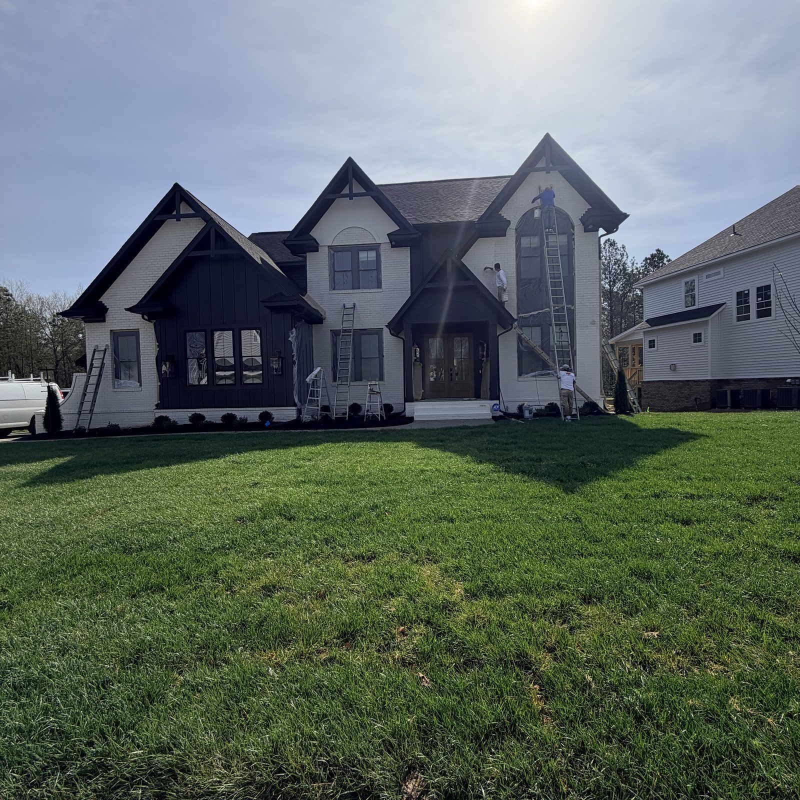 Finished Black And White Farmhouse Exterior Painting