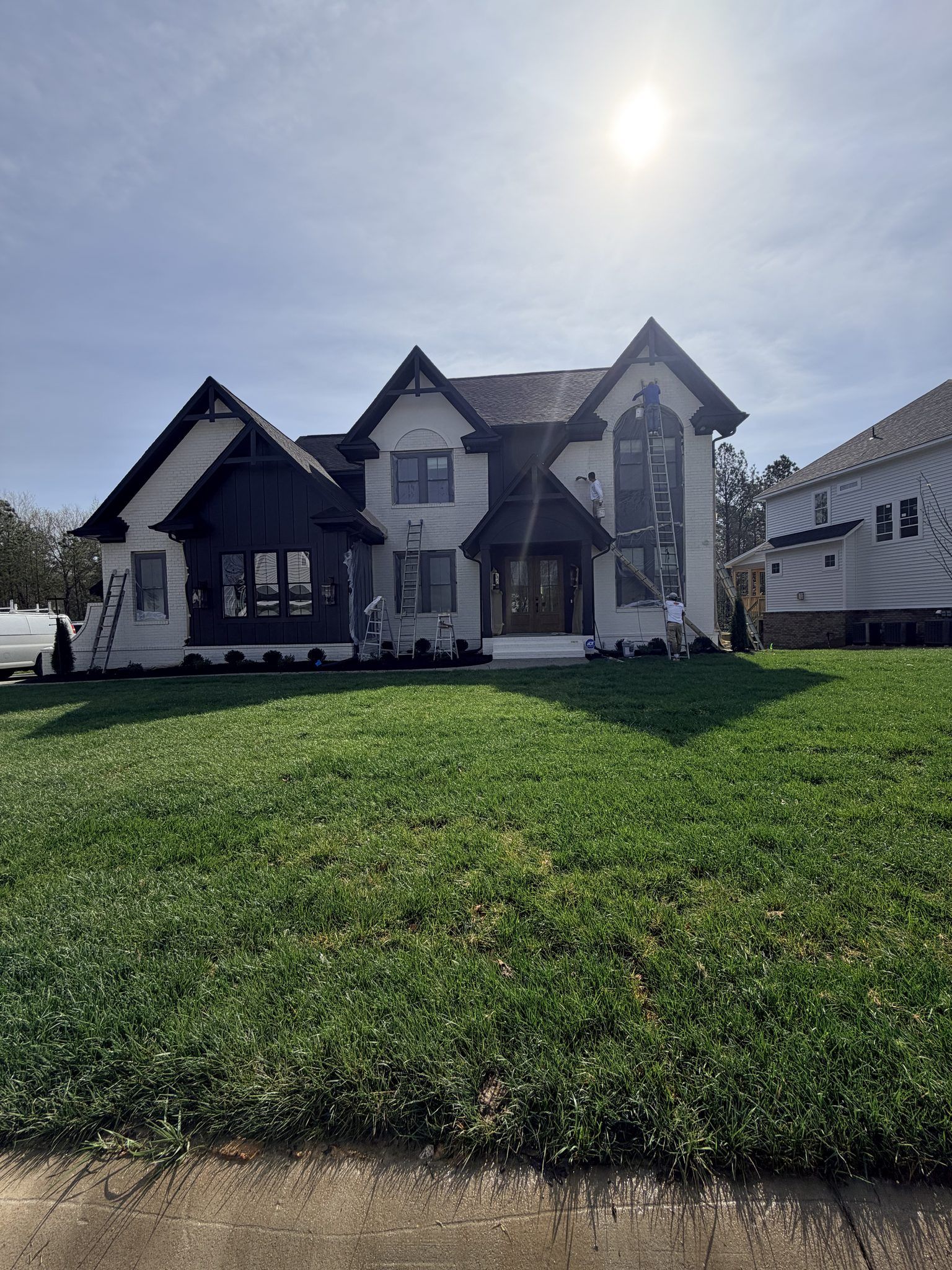 Finished Black And White Farmhouse Exterior Painting