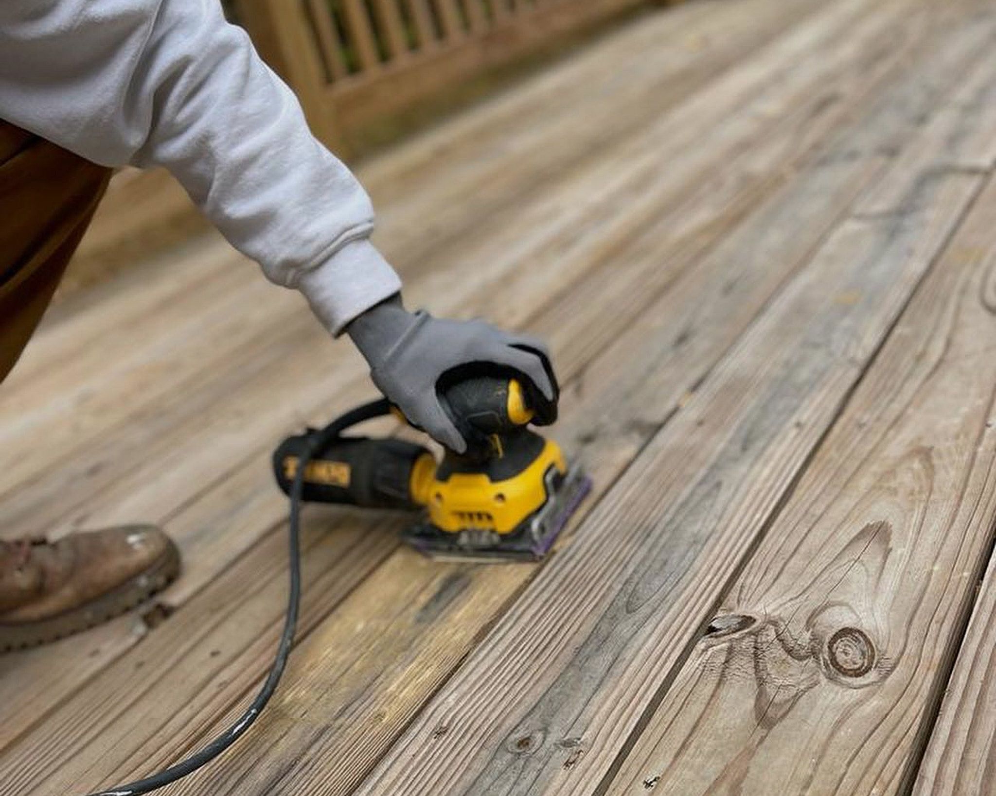 Lets Upgrade Painting Employee Sanding Deck Boards