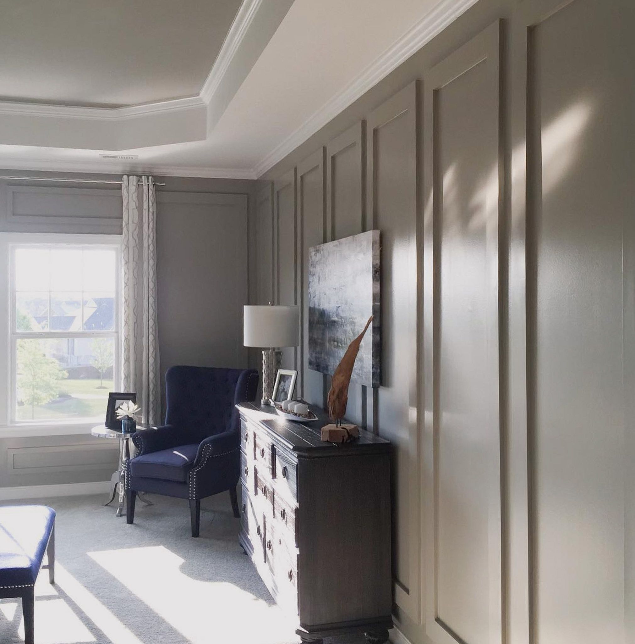 Side View Of A Bedroom With Vertical Rectangle Textures On Grey Walls And A Ceiling Painted In White And Smoke Colors
