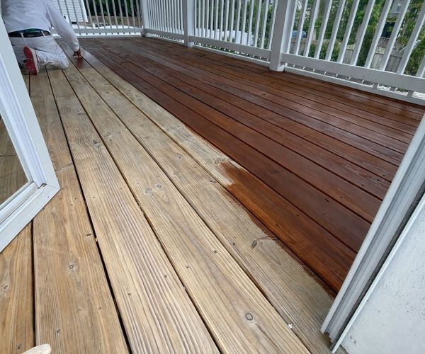 Raised Deck Boards Half Stained During Deck Staining