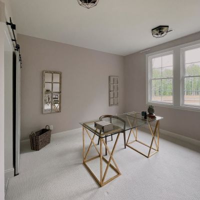A Room Painted In White Color, With A Glass Table And A Chair, With White Carpet Laid On The Floor