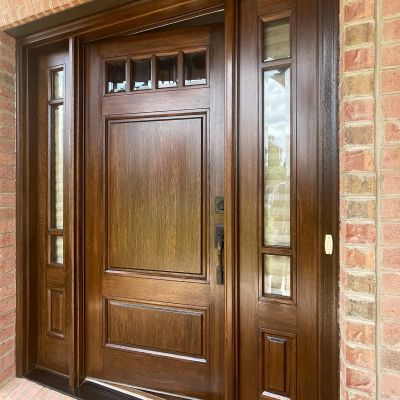 A Solid Wooden Main Door Of A House Polished And Painted With A Shiny Dark Brown Color