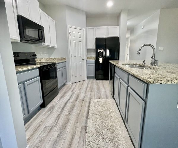 Kitchen With Refinished Gray Lower And White Upper Cabinets